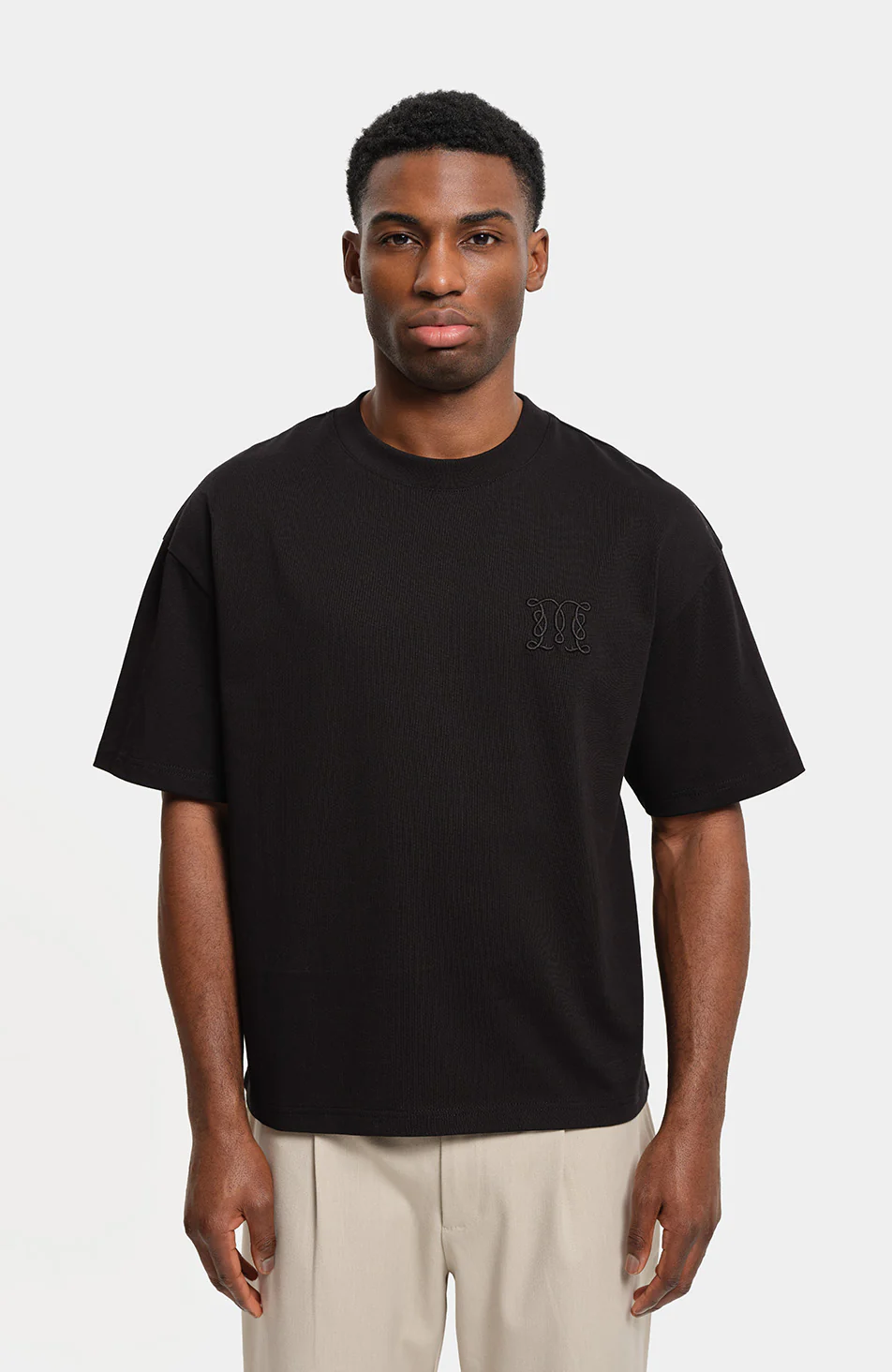 Embossed Monogram Back Logo T-shirt in Black - Image 4
