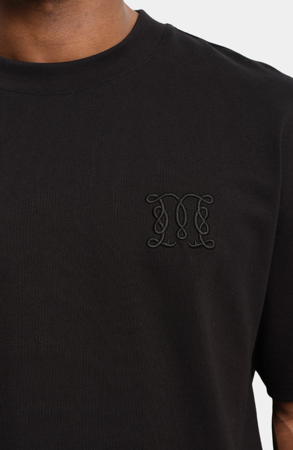 Embossed Monogram Back Logo T-shirt in Black - Image 5